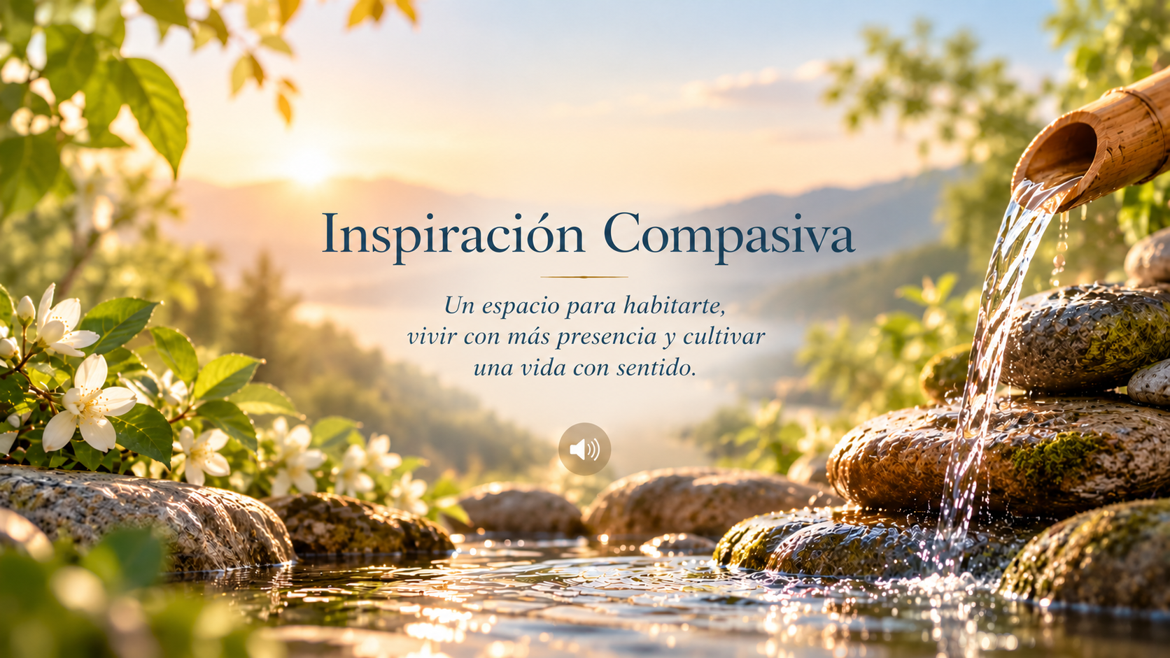 Inspiración Compasiva. Un espacio para habitarte, vivir con más presencia y cultivar una vida con sentido. Fuente de bambú con agua sobre piedras, flores y luz de amanecer.